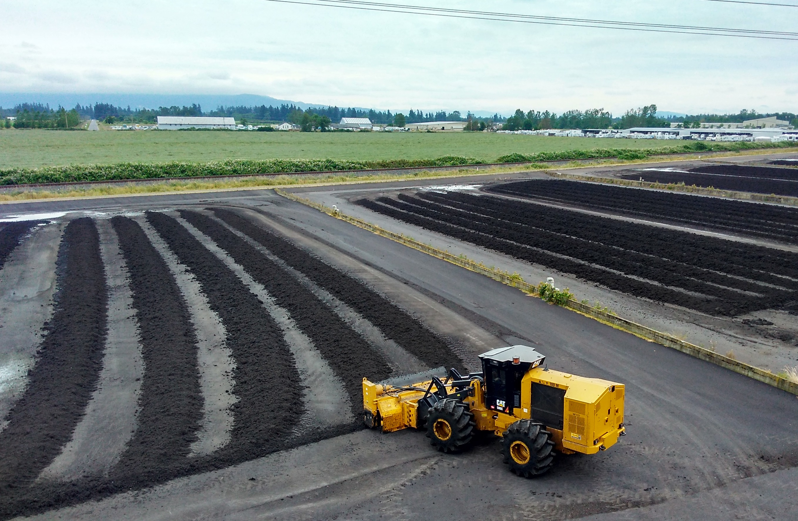 Turning over biosolids for additional drying